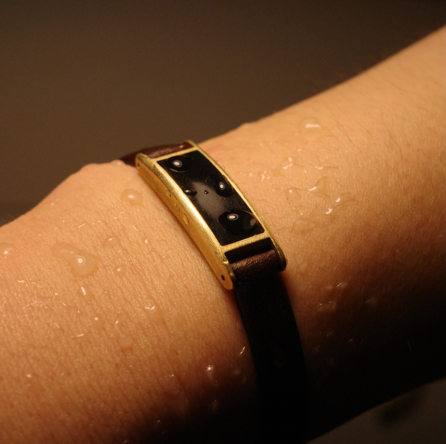 Ray in Sunlit Gold beaded with water droplets