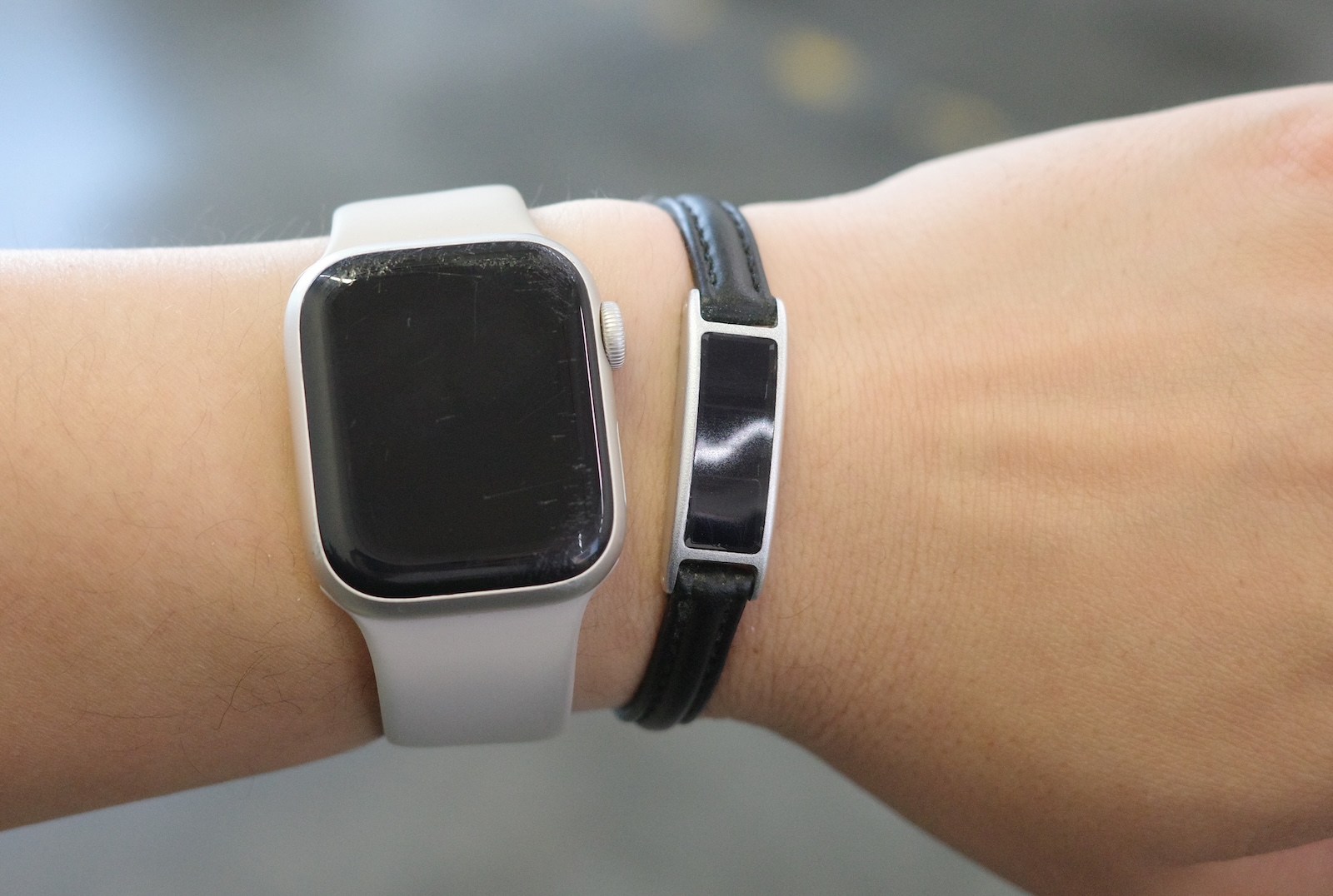 Ray next to an Apple Watch on the same wrist
