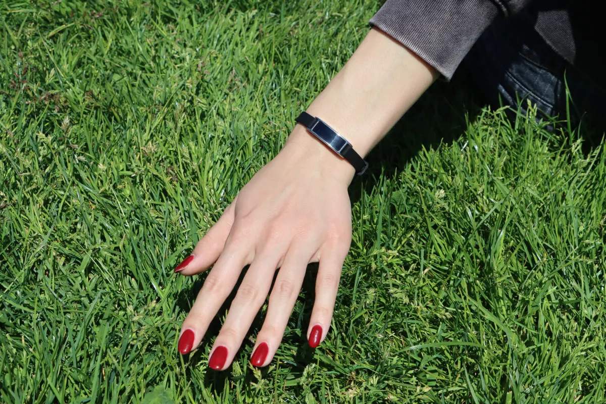 Ray health tracker worn in the grass