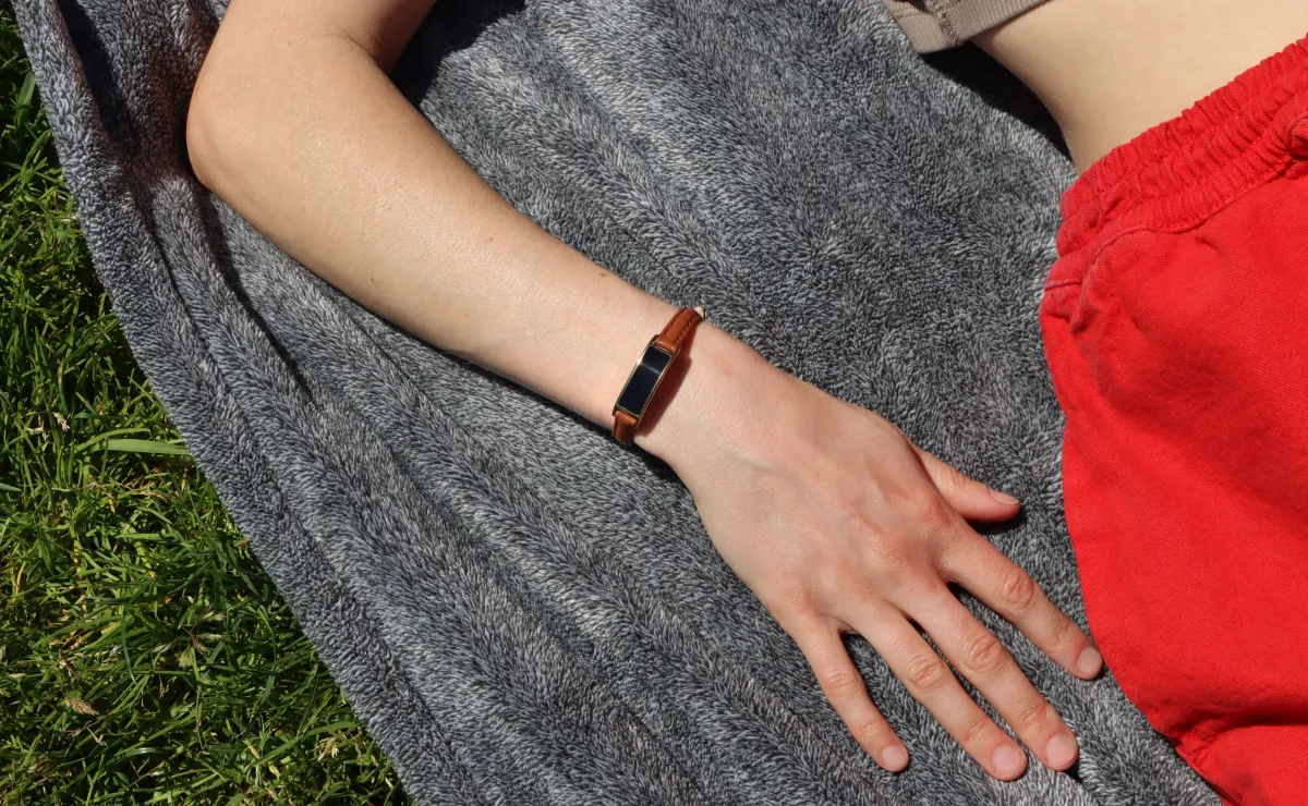 Ray health tracker on a wrist outdoors